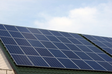 Fototapeta premium Solar panel on a green roof.