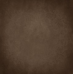 Abstract golden brown grunge textured background with floral frame.