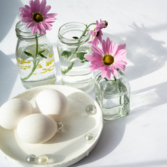 Flowers and eggs in Easter greeting card for happy birthday