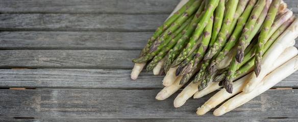 Asparagus on rustic gray wooden planks