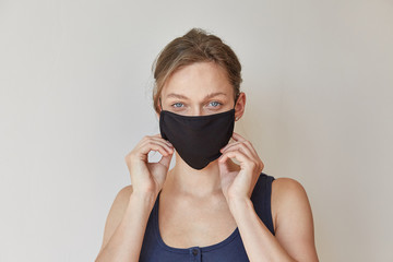 Girl in black medical mask