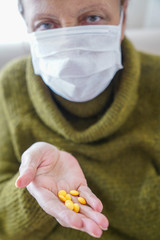 pills in a Senior's hands. Painful old age. Caring for the health of the elderly