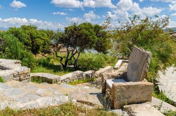 Stone armchair in the ancient theater on the island of Paros. Cyclades, Greece