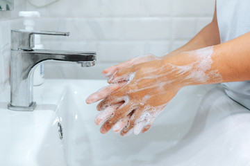 Asian woman washing with Soap hands thoroughly to Corona virus prevention