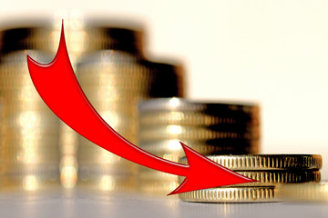 Red arrow on the background of money. The concept of reducing financial indicators .