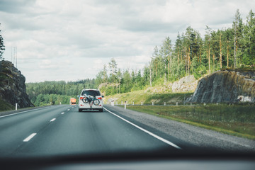 Car driving on winding road for new adventures POV