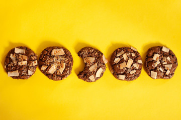 Chocolate chip cookie on a yellow background