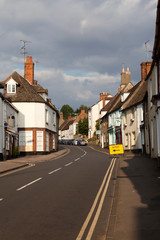 Fototapeta na wymiar Faringdon (England), UK - August 05, 2015: The main road in Faringdon village, .Faringdon, Oxfordshire, England, United Kingdom.