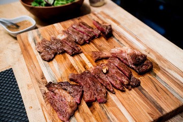 grilled meat  on a wooden board
