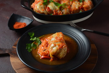 Cabbage rolls stuffed with ground beef and rice in tomato sauce