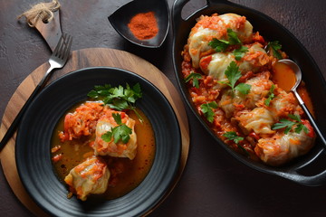 Cabbage rolls stuffed with ground beef and rice in tomato sauce