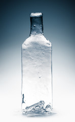 Bottle form, made from clean transparent ice. Purity concept.