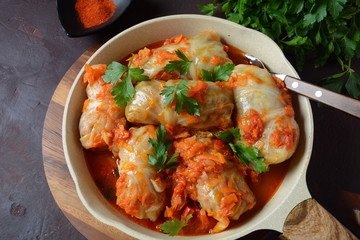 Cabbage rolls stuffed with ground beef and rice in tomato sauce