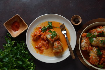 Cabbage rolls stuffed with ground beef and rice in tomato sauce