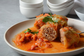 Cabbage rolls stuffed with ground beef and rice in tomato sauce