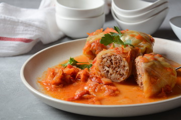 Cabbage rolls stuffed with ground beef and rice in tomato sauce