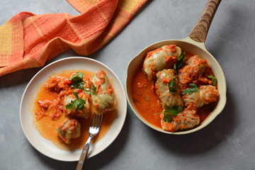 Cabbage rolls stuffed with ground beef and rice in tomato sauce