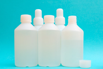 Disinfectant liquid in a white bottle. Therapeutic drug. Disinfection against coronavirus.
