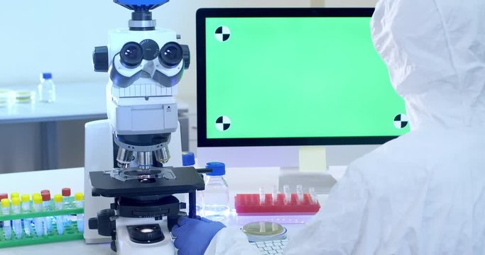 The scientist uses a microscope to study dangerous bacteria and viruses.