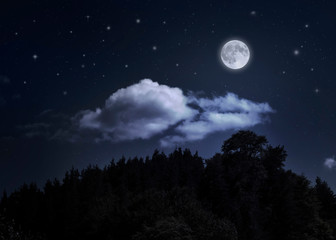 Naklejka na ściany i meble Night starry sky and moon over the mountain