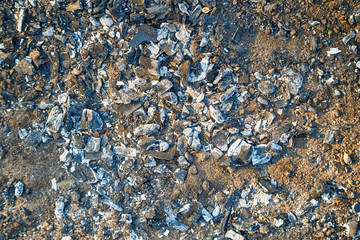 Ash on the ground after a fire. Abstract background.