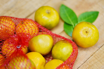 Harvest orange and orange leaf healthy fruits concept - Fresh orange fruit on wooden background