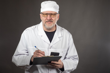 A friendly doctor listens to the patient. The doctor listens to