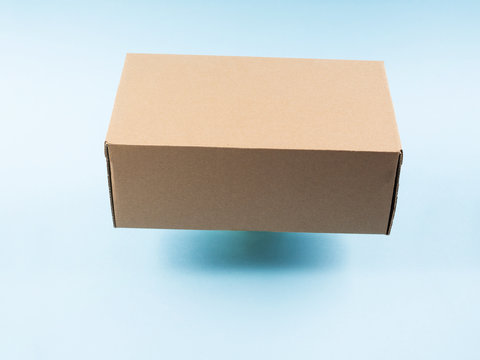 Contactless Delivery Concept. Cardboard Box In Levitation