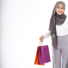 Muslim girl shopping bags closeup
