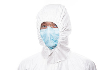 Portrait of young nurse in protective white medical uniform during coronavirus pandemic. Epidemic, pandemic of coronavirus covid 19.