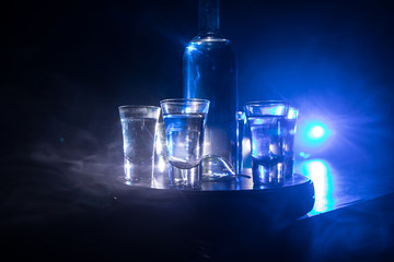 Vodka in bar on a glass table, focus on glass. Club drink concept.