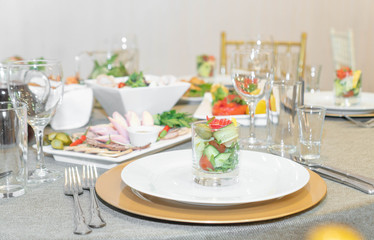 Dining table full of food served with light dishes