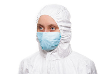 Portrait of young nurse in protective white medical uniform during coronavirus pandemic. Epidemic, pandemic of coronavirus covid 19.
