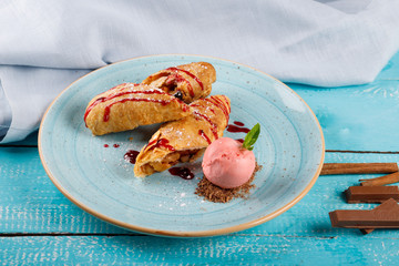 Apple strudel with vanilla ice cream and mint
