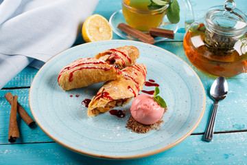 Apple strudel with vanilla ice cream and mint