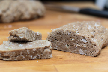 Homemade sliced seitan on wooden board