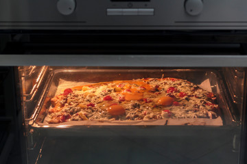 Delicious Homemade pizza cooking in the oven