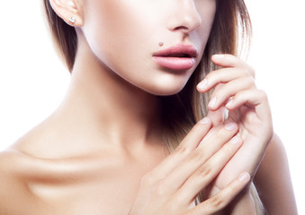 Fototapeta na wymiar Lips, beauty part of model young woman face, healthy perfect skin, hands near face, nude natural makeup