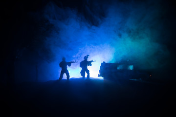 Obraz na płótnie Canvas War Concept. Battle scene on war fog sky background, Fighting silhouettes Below Cloudy Skyline at night.