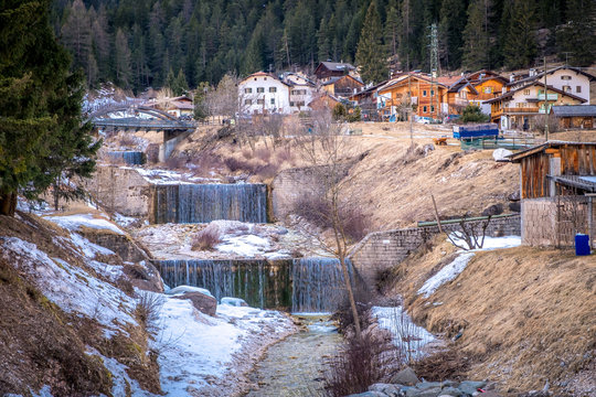 river waterfalls in Pera di Fassa in winter. Trentino at the northern Italia. Val di Fassa, Dolomiti