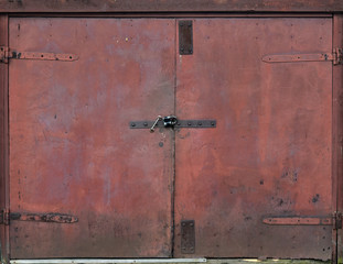 Metal old and shabby doors (gates). Vintage door texture.