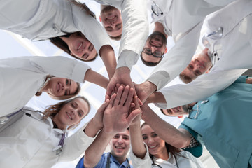 Obraz na płótnie Canvas bottom view. diverse medical professionals showing their unity.