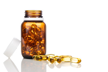 Fish oil gel capsule with bottle. It containing omega-3 polyunsaturated acid EPA and DHA enhances heart and health.