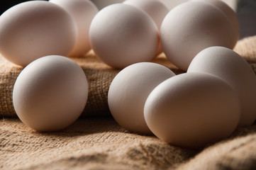 Chicken eggs on burlap, rustic still life