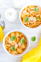 Pasta casserole with egg in white ceramic tins, selective focus