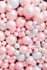 background texture of foam balloons. a wall of balloons. pink and white balloons