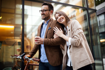 Plakat Office woman with business man couple enjoying break while talking flirting outdoor