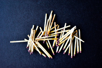 Household matches and boxes for lighting on a blue background
