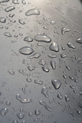 Fototapeta na wymiar rain drops on metalic floor background