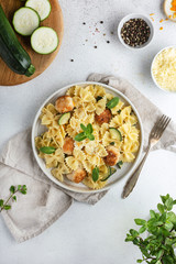 pasta with mint zucchini meatballs on the table top view Italian food farfalle